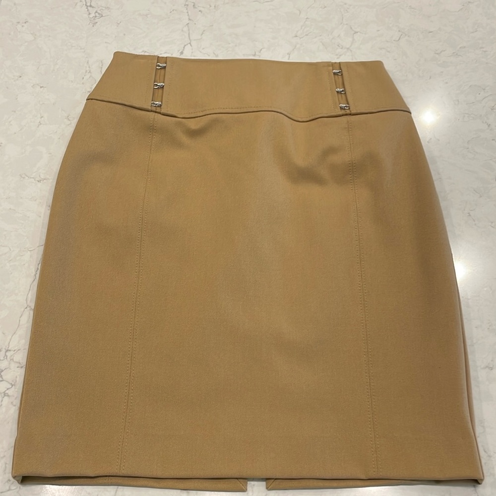Stylish camel color pencil skirt in size 4.